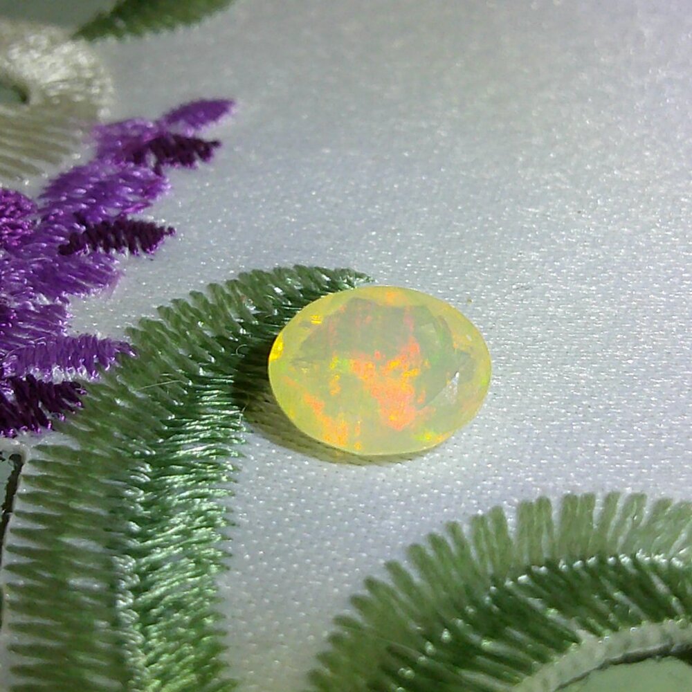 JTV Faceted Ethiopian Opal 9x7mm Oval 1ctw Loose Gemstone